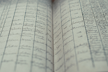 Handwritten records in book