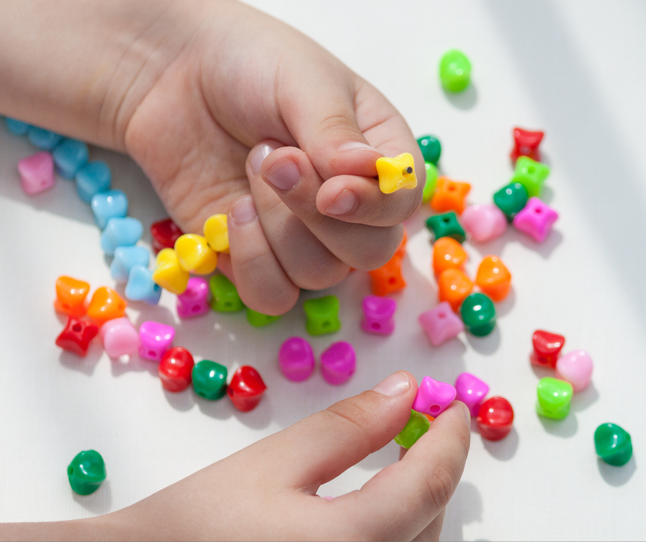 Little hands with pony beads