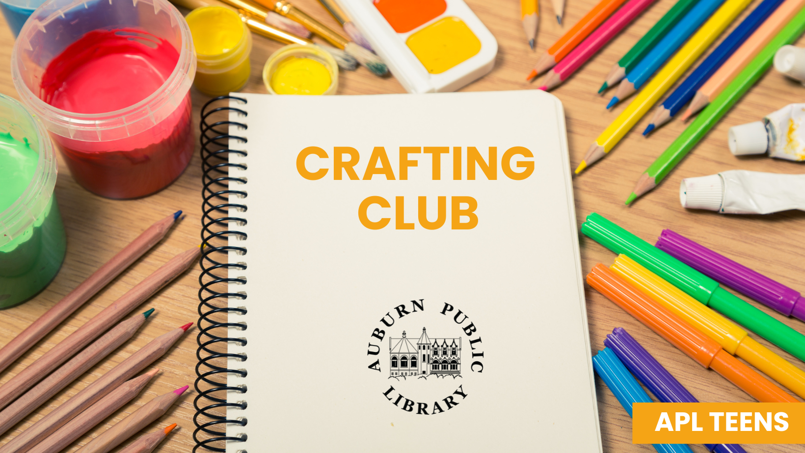 Craft supplies and notebook surrounding program title text.