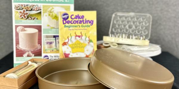 Cake pans, frosting bags and tops, books on how to decorate