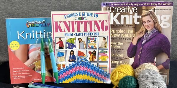Assorted yarn, needles, knitting books and magazines