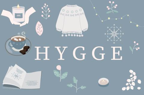 Hygge with pale blue background cozy drawings of books and hot cocoa
