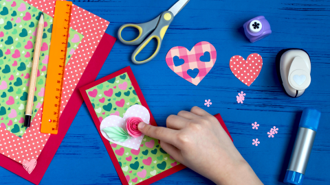 blue table with art crafts for kids card making 