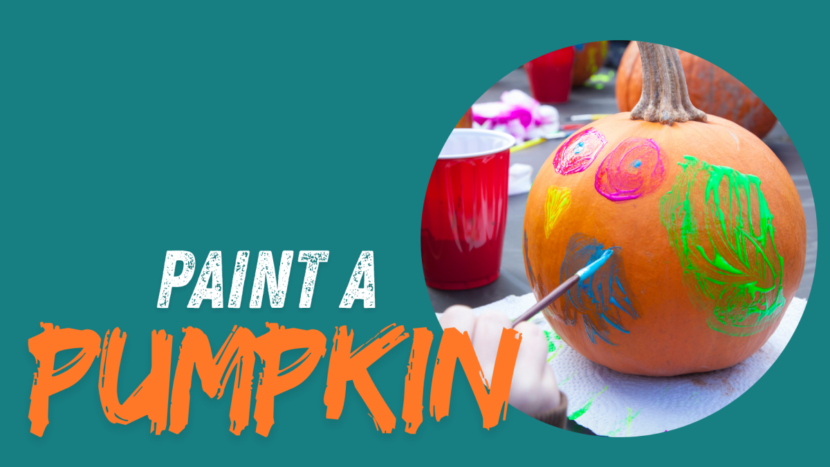 Pumpkin being painted with teal background